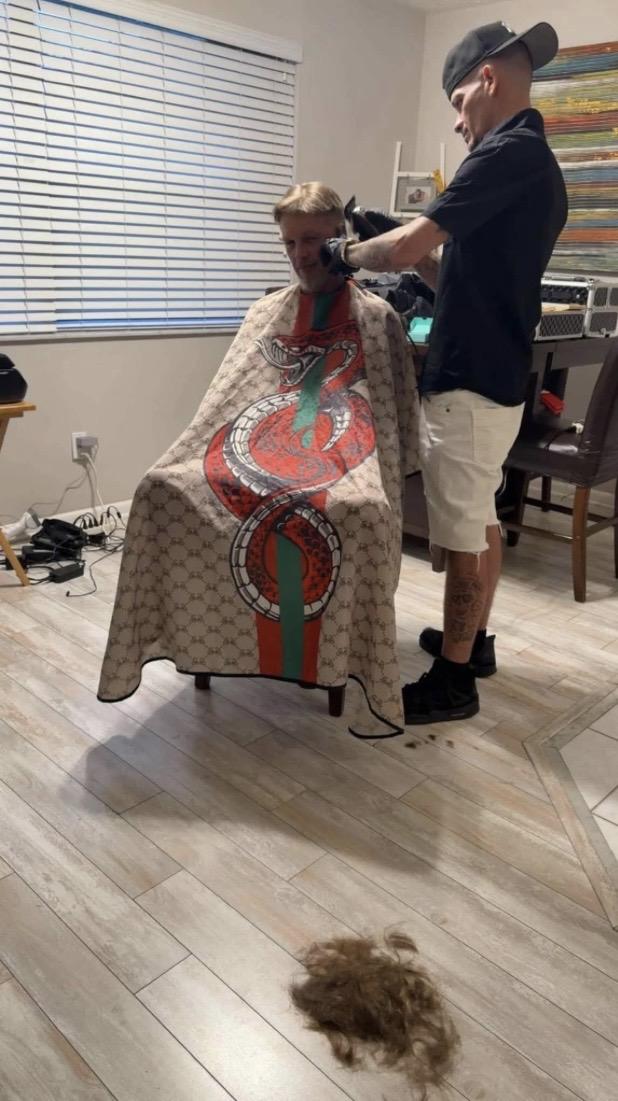 Anthony cutting a client's hair during a mobile barber appointment