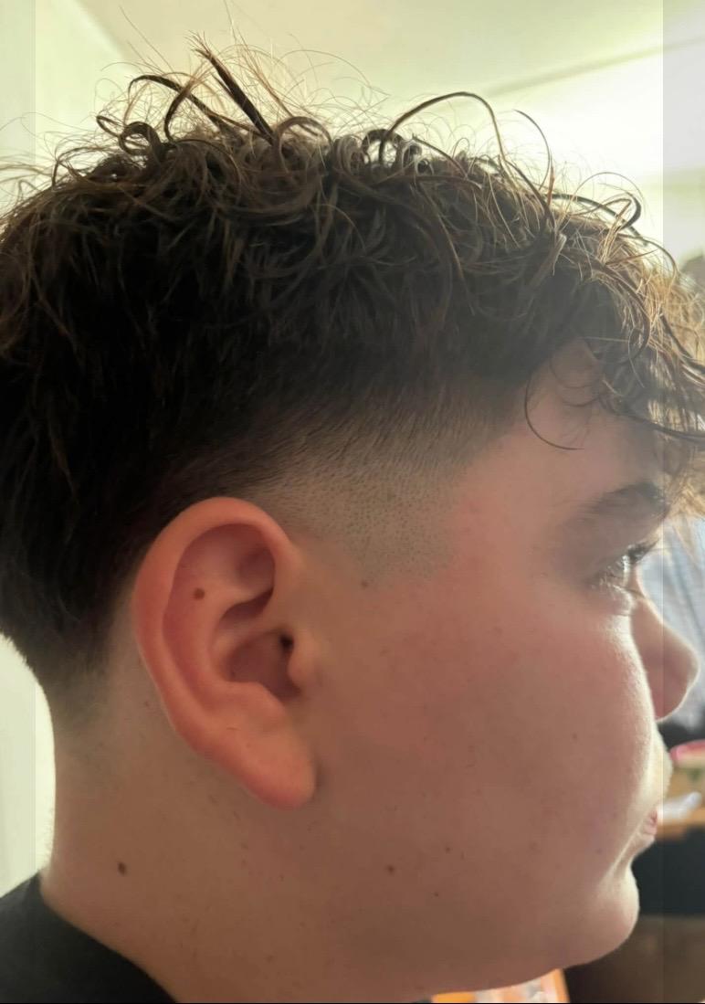 Textured haircut with blended fade by Look Good Feel Good Mobile Barbering
