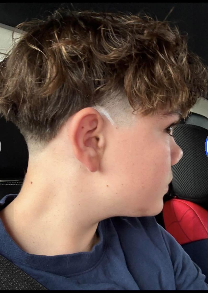Textured haircut with clean side fade